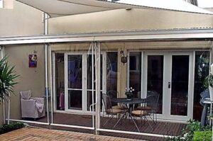 courtyard_geared_pvc_edited Geared Roller Clear PVC Bistro Blinds